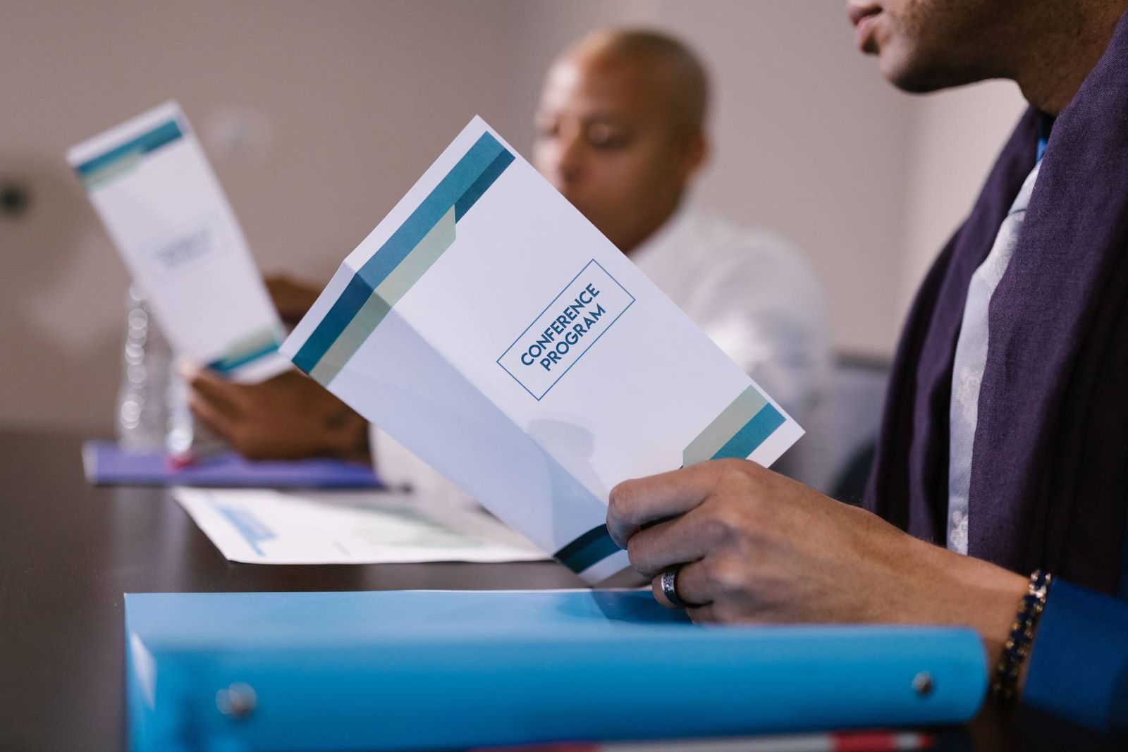 An attendee holds an open 