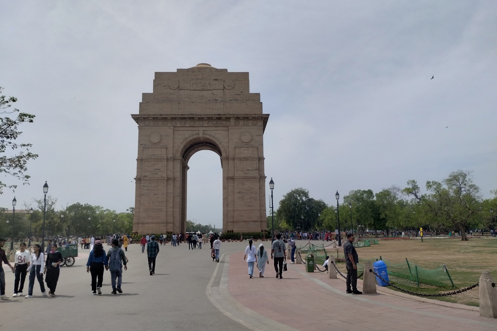 The India Gate war memorial in New Delhi with visitors on its approach