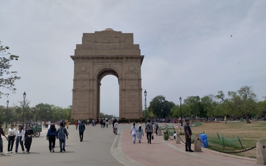 The India Gate war memorial in New Delhi with visitors on its approach
