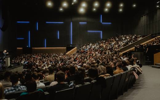 A full auditorium at a conference plenary session