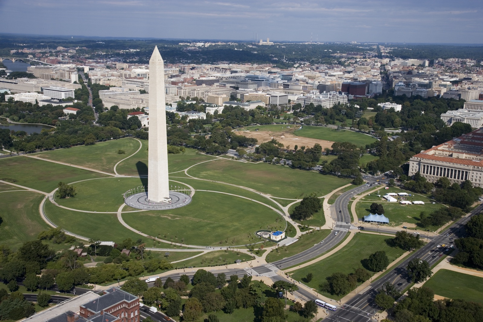 Aerial view of the Washington Monument with the White House and downtown beyond