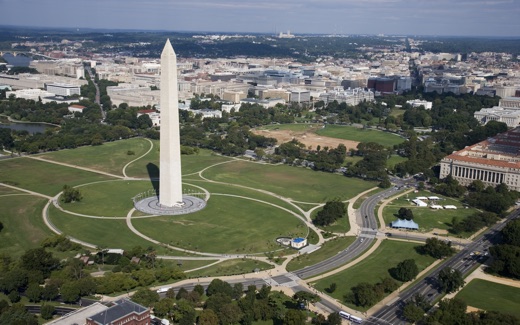 Aerial view of the Washington Monument with the White House and downtown beyond