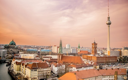 Berlin skyline at sunset with the Fernsehturm television tower and Rotes Rathaus