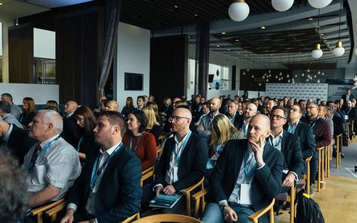 Delegates listening to a session at a regulatory affairs conference